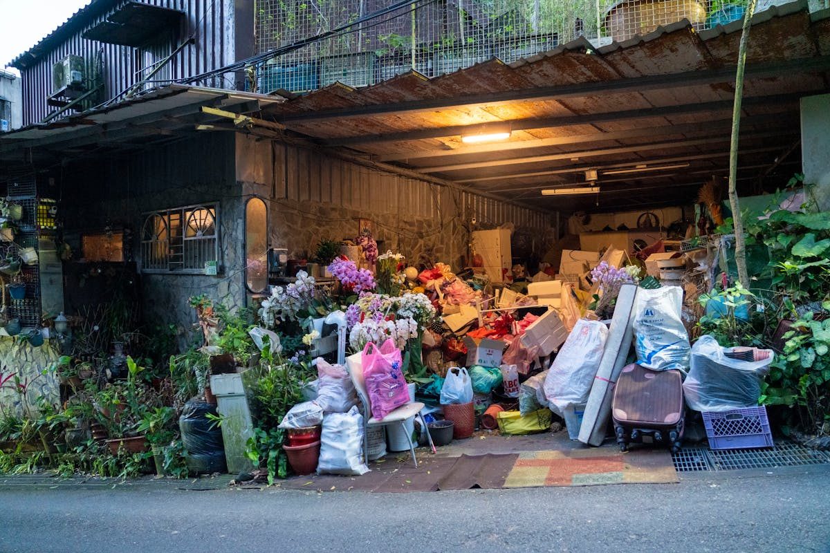 A garage piled with household clutter and boxes